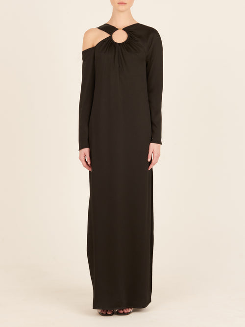 A timeless Turin Dress Black with elegant simplicity, featuring a cut out shoulder.