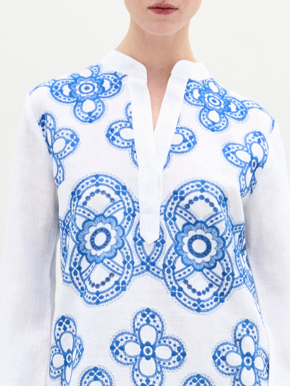 A woman wearing the Adalys Tunic on a white background.