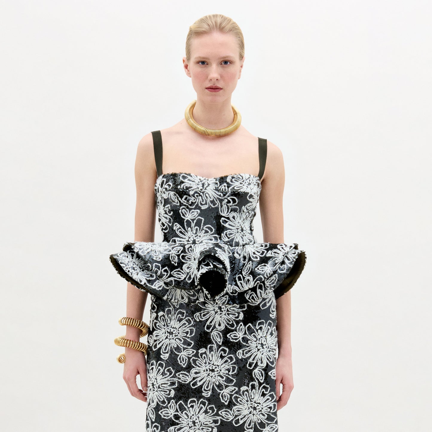 A woman wearing the Adriana Top black and white on a white background