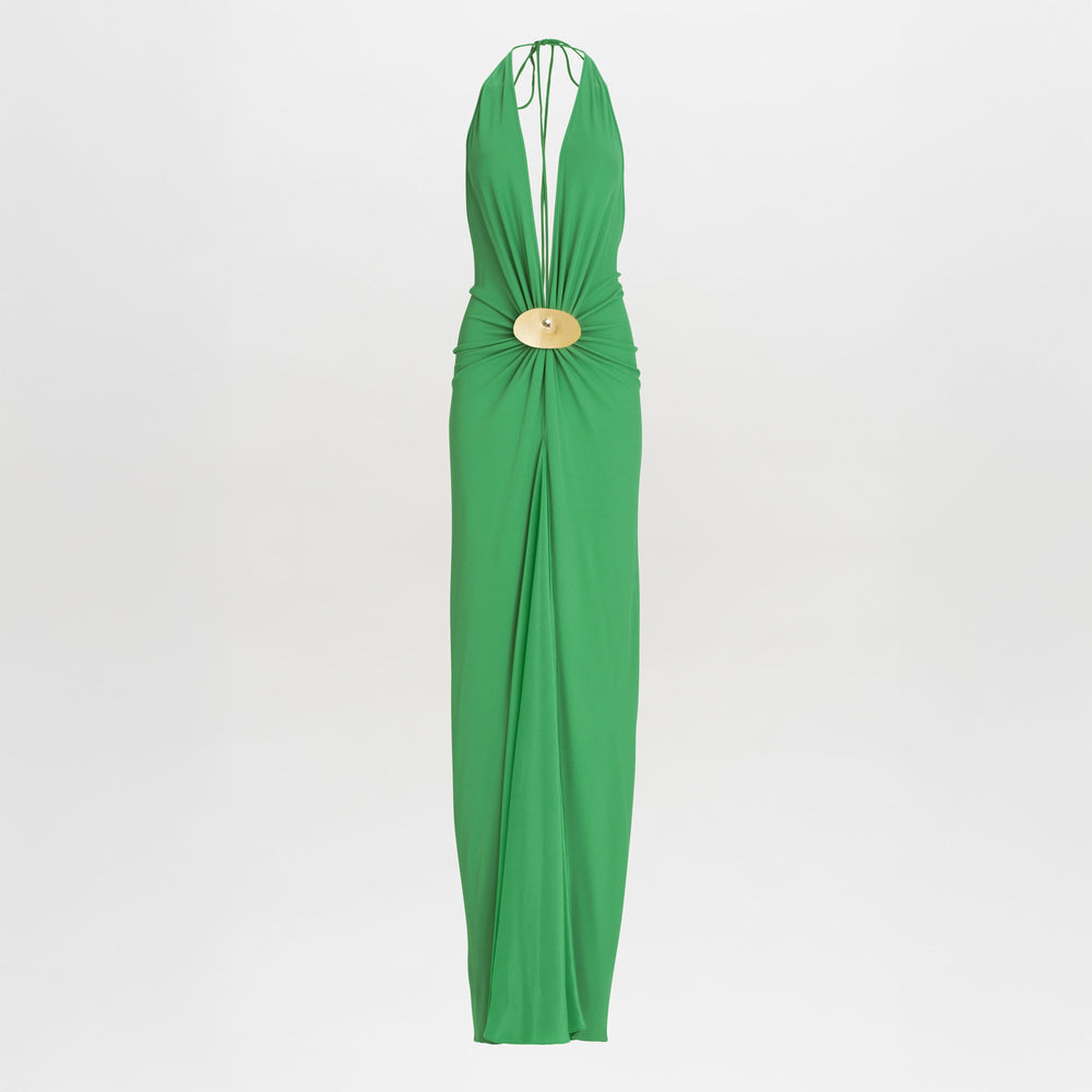 The Aiko Dress is a sleeveless, floor-length green maxi with a halter neckline, deep V front, and gold circular waist detail, crafted from luxurious Italian fabric.
