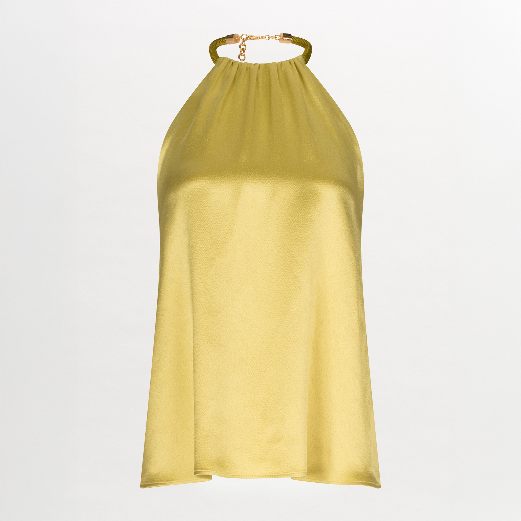 The model is wearing a Agatha Blouse Lime with a belt and metallic jewelry.