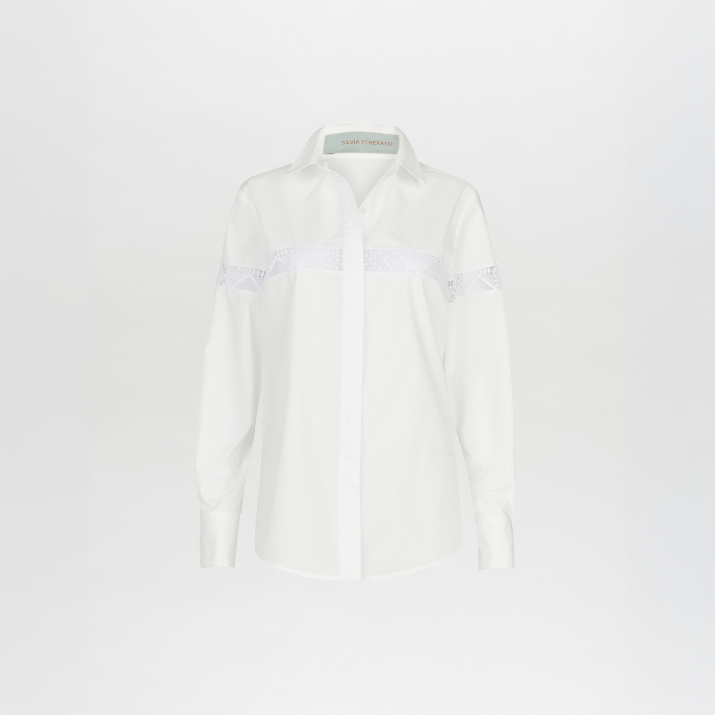A white Andrea Shirt White with embroidery detail.