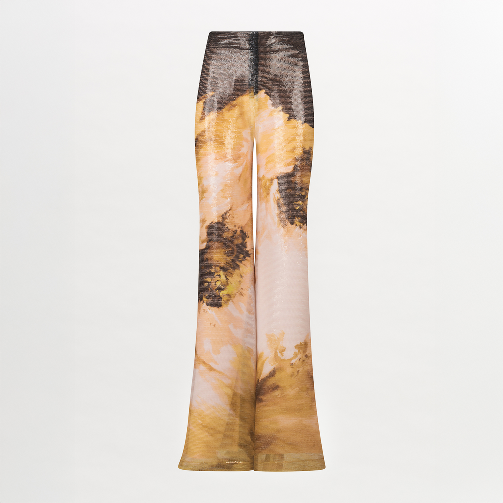 A pair of Avellino Pant Golden Peony with an abstract print.