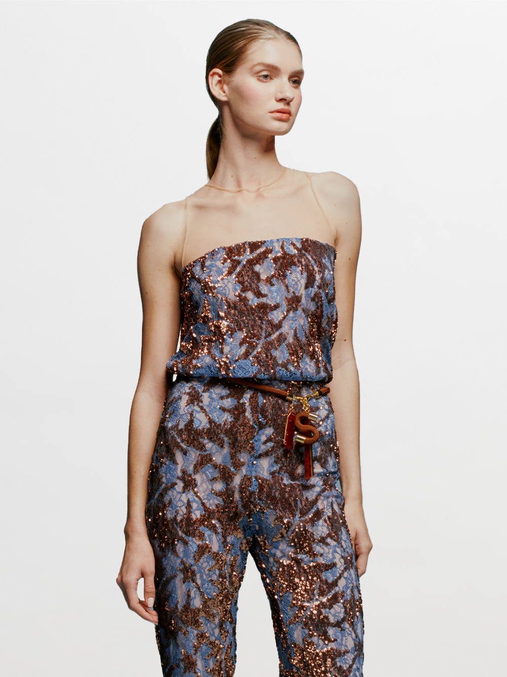 A model wearing a pre-order Brisa Blouse Navy Ochre Sequin available for shipment by date.