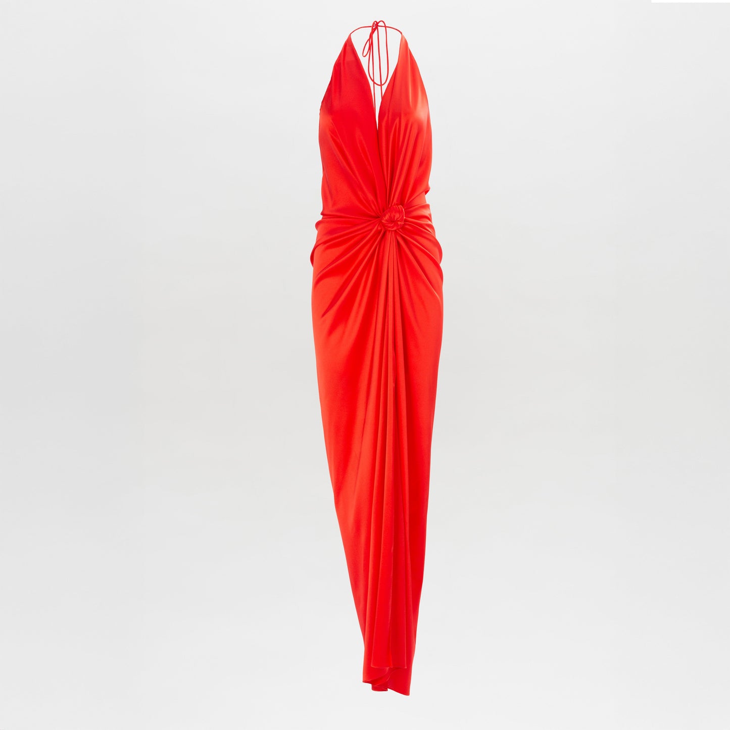 The Jazmin Dress is a sleeveless, floor-length red halter dress featuring a deep V-neckline and gathered fabric at the waist, shown against a plain white background.
