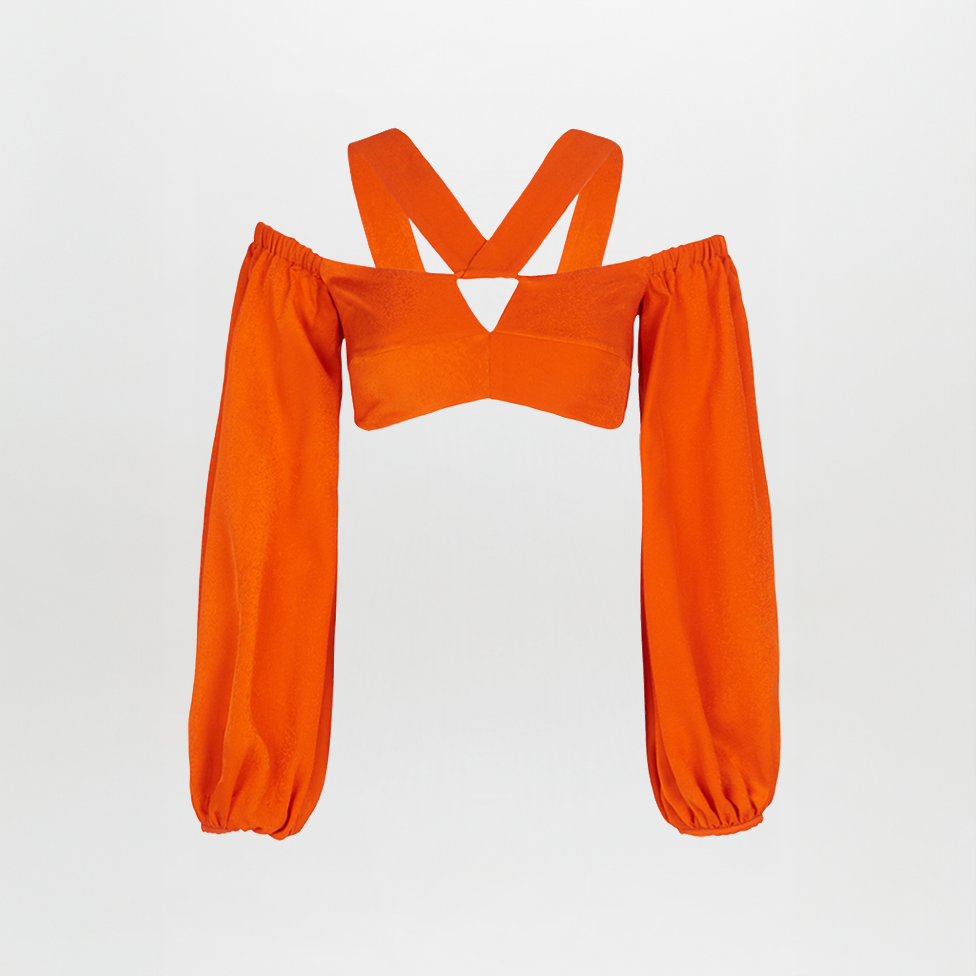 Carole Top Bright Orange off-the-shoulder crop top with billowing sleeves and a cross-body strap design, isolated on a white background.