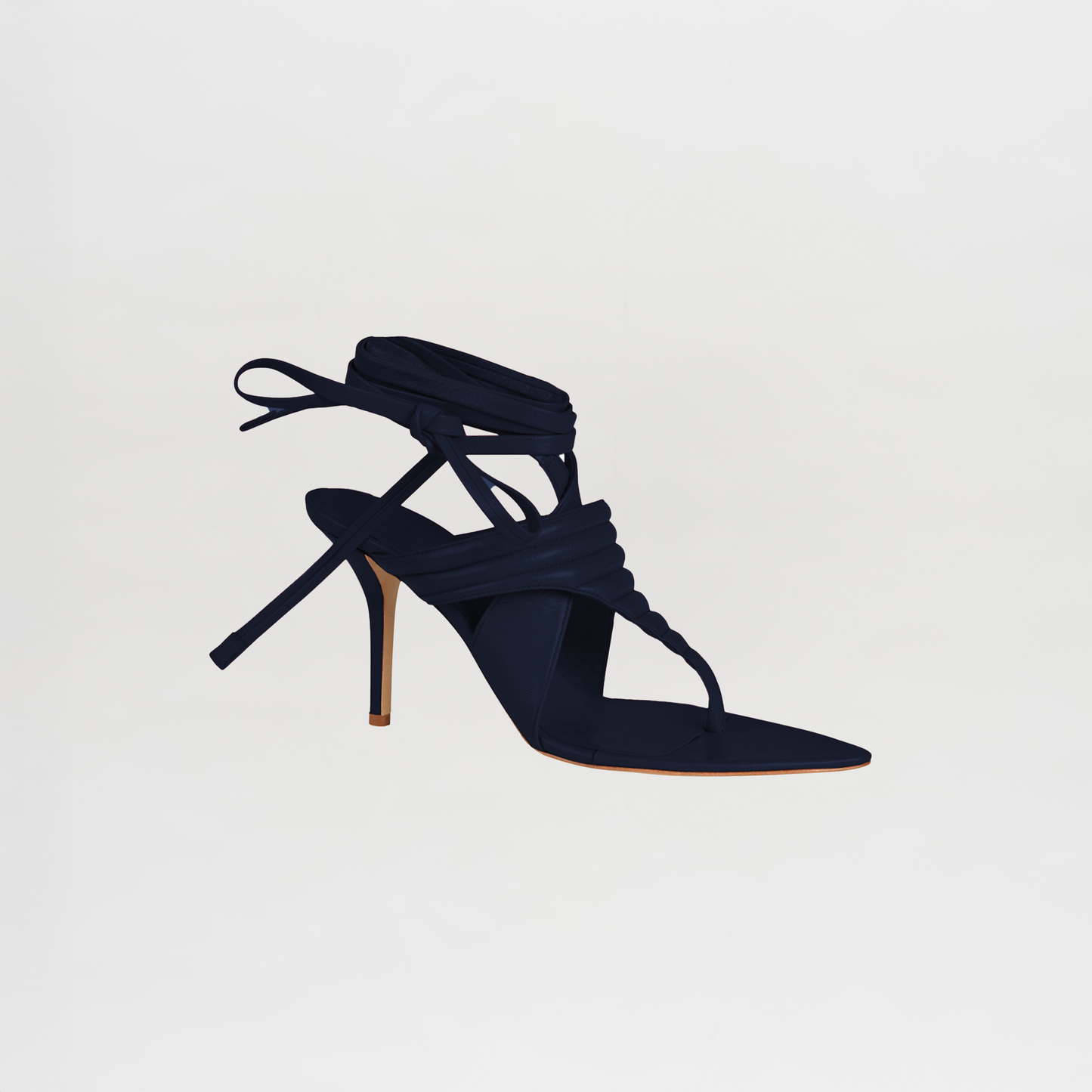 A single Dalila Heel in navy Italian calf leather, featuring a pointed toe, thin stiletto heel, and multiple wrap-around ankle straps, shown against a plain white background.