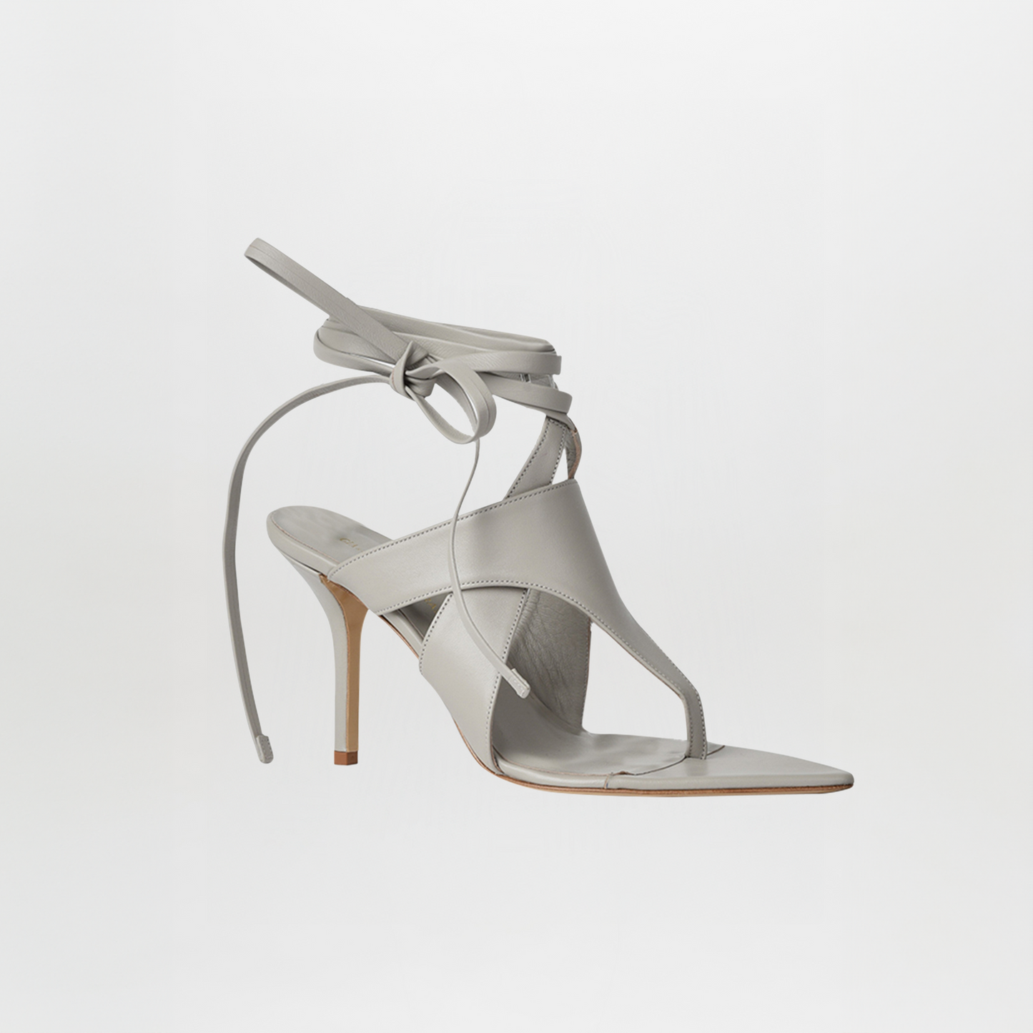 The Domenico Heels Gray by GIA Couture feature light gray Italian leather, a thong and square toe box, and a wrap-around ankle strap, shown on a plain white background.