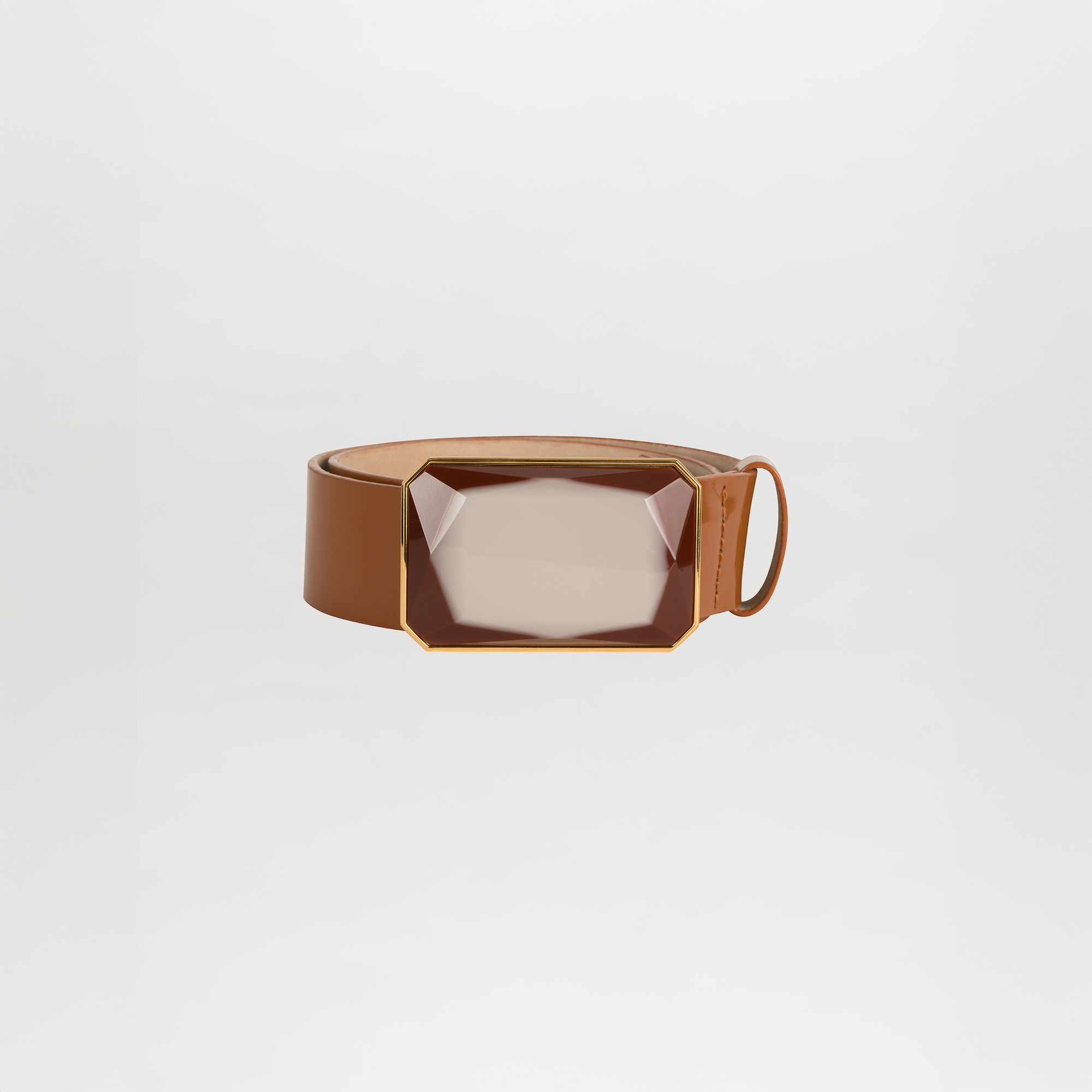 The Dora Belt, a brown leather belt with a large rectangular faceted buckle in a gold-tone frame, is ready to ship and is displayed against a plain white background.