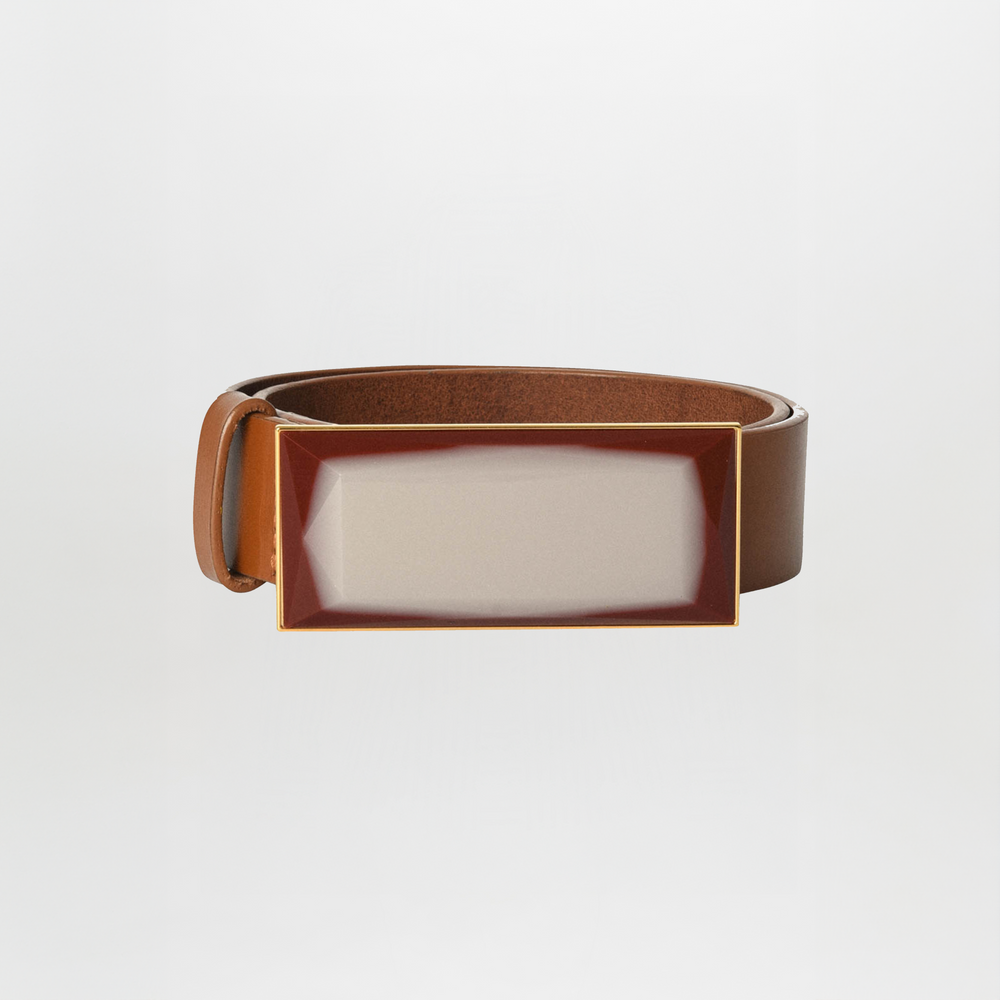 A brown leather Dora Belt Pearl by Silvia Tcherassi, featuring a large rectangular reflective buckle, displayed against a plain white background.