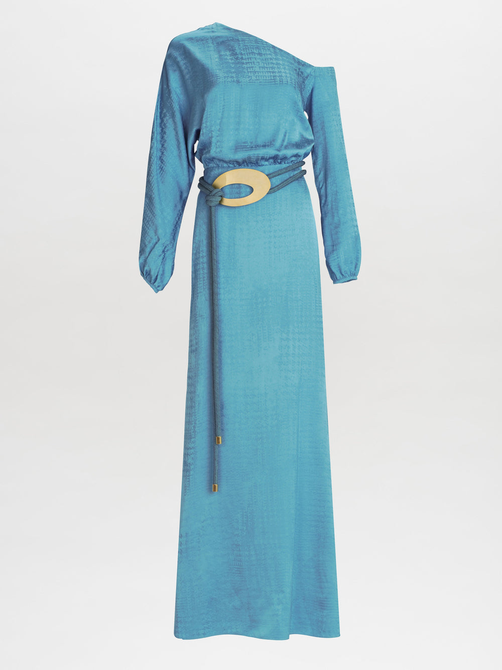 The Elga Dress is a long, one-sleeve turquoise outfit with a textured pattern and a decorative belt featuring a prominent gold circular buckle.