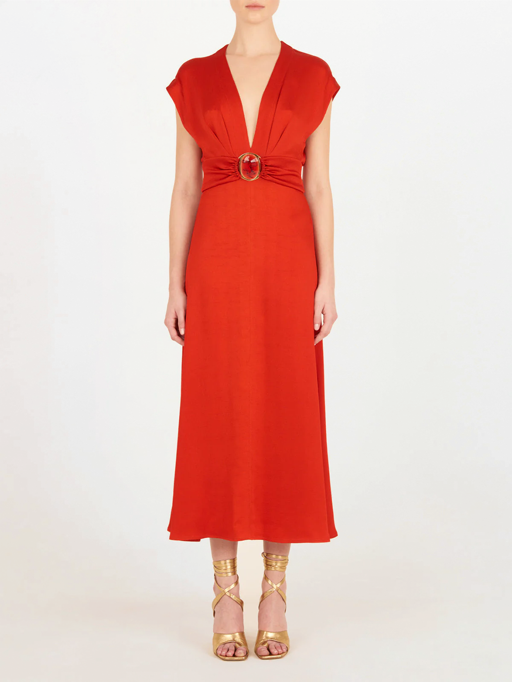 Emmeline Dress Rouge, with a belt that features a plunging neckline.