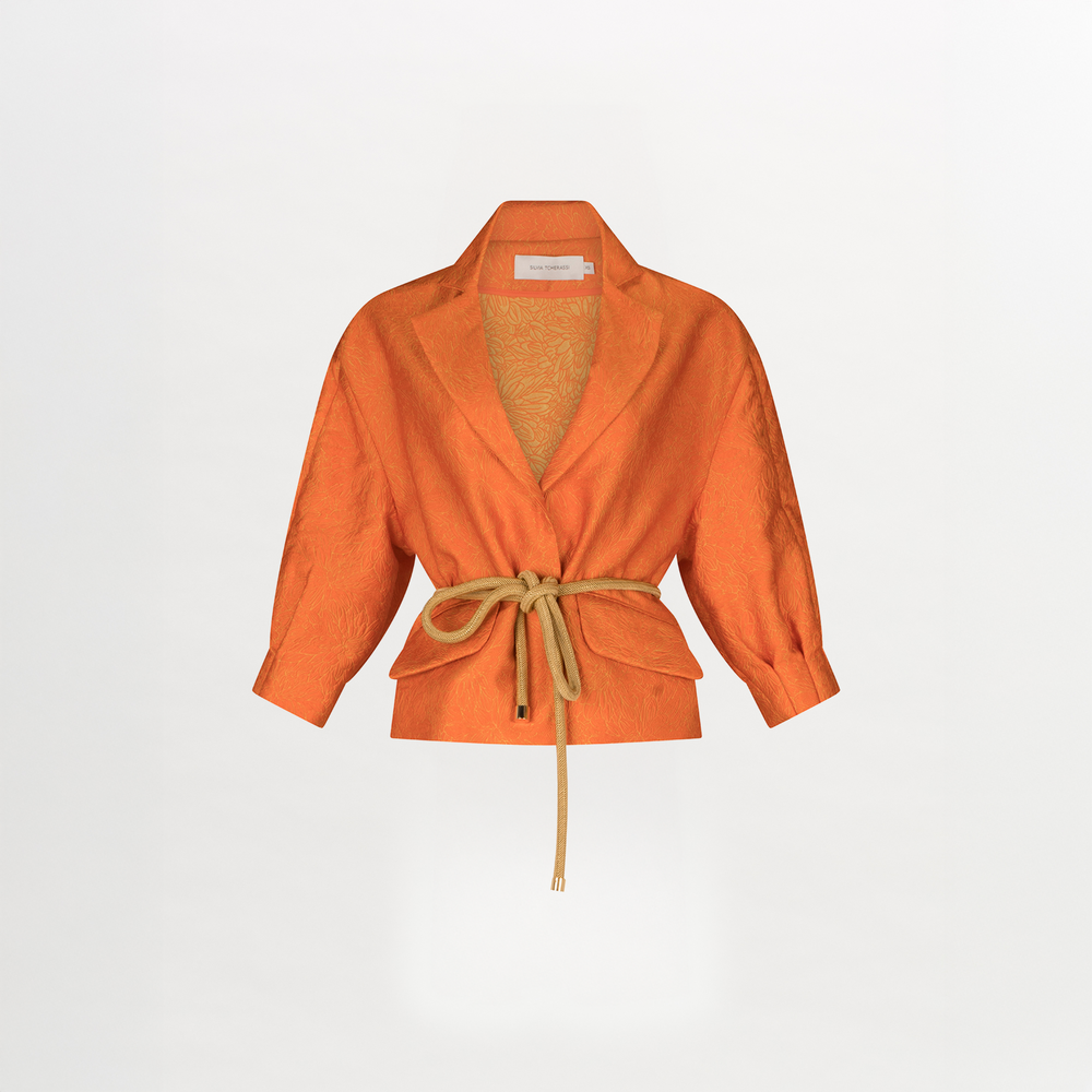 A women's Gianna Jacket Orange Petal with a belt, featuring a relaxed fit.