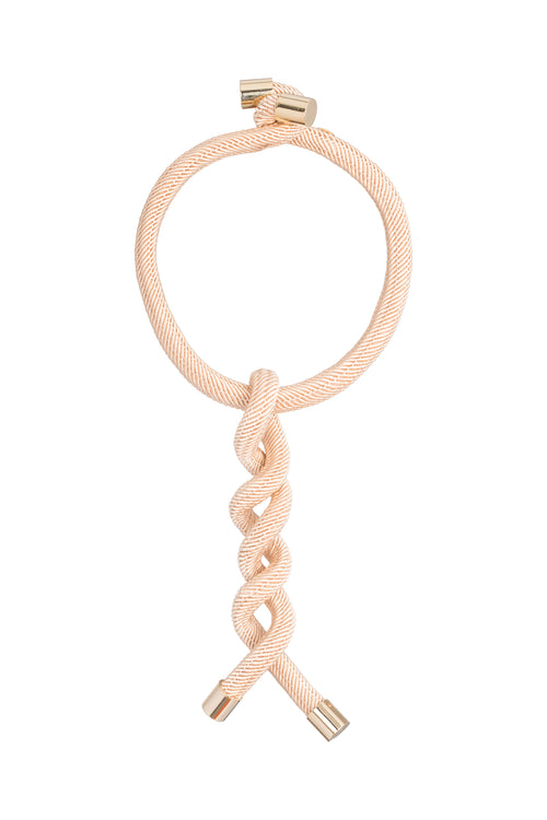 A Hazel Necklace Beige with metallic jewel-like accents on a white background.