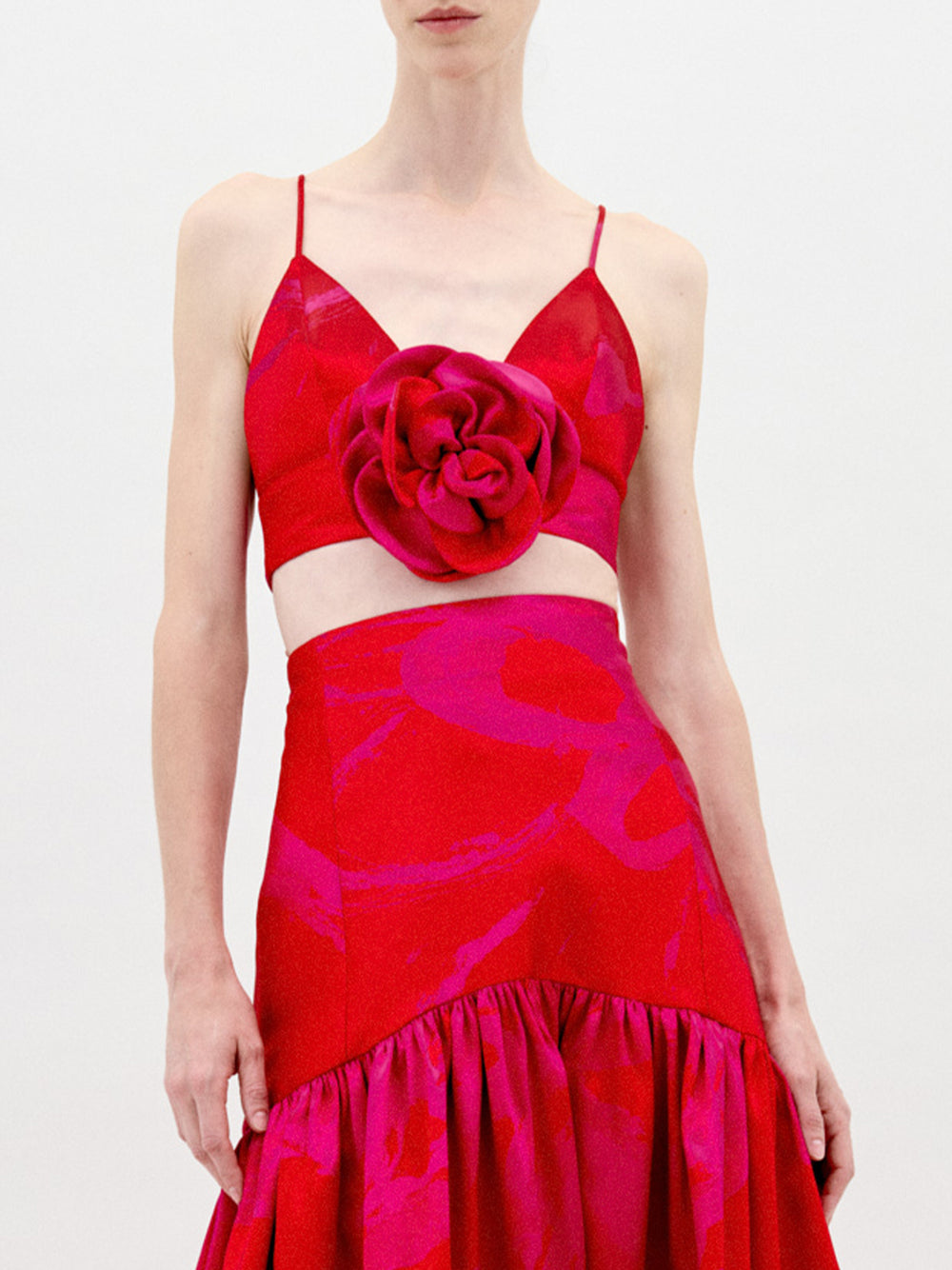 A person stands against a plain background wearing the Helen Dress Set.