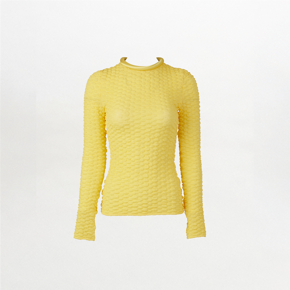 A versatile, long-sleeved Jari Top Yellow with a ruffled neckline made from embossed jacquard fabric.