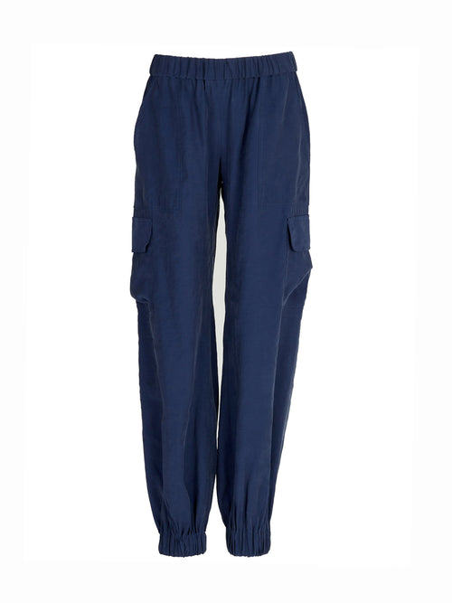 A pair of Jess Pant Navy with an elastic waistband and pockets.