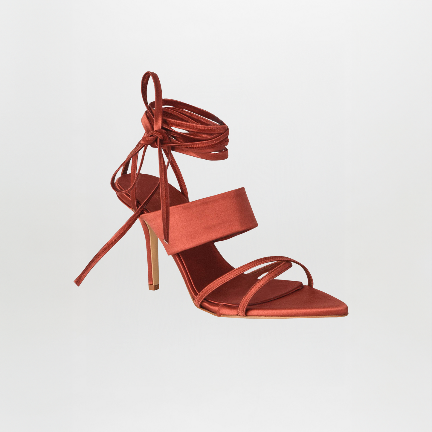 The Jimena Heels Bronze feature a square toe, wide front strap, thin toe and ankle straps, a wrap-around ankle tie in reddish-brown satin, and luxurious Italian calf leather for timeless elegance.