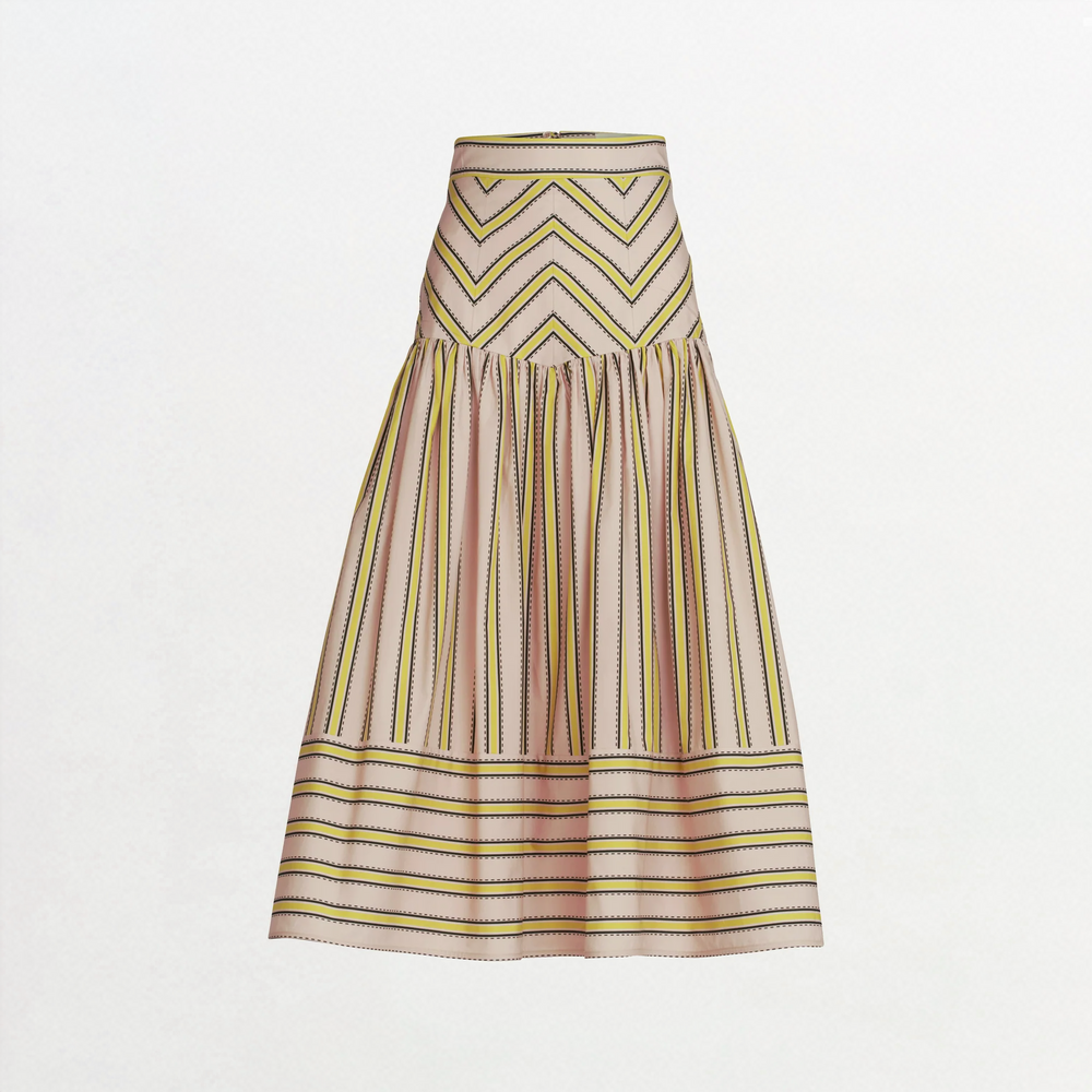 The Kristina Skirt is a high-waisted, ankle-length midi with a flared silhouette, made from 100% Italian cotton and featuring pink, yellow, and black geometric zigzag and stripe patterns.