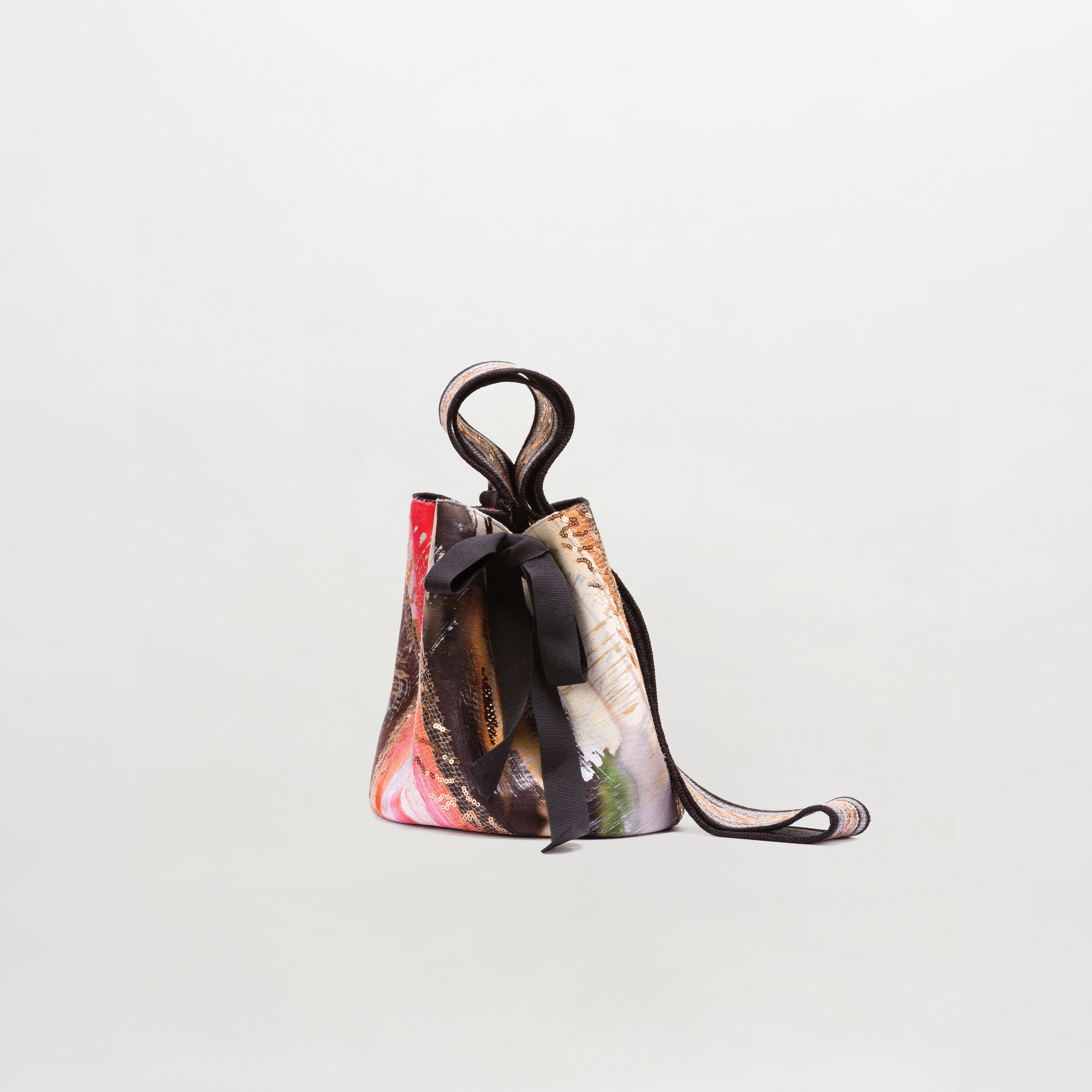 Multicolored handbag with a strap on a light gray background