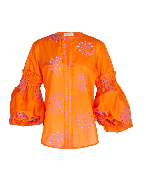 An orange Lucaya Blouse with embroidered sleeves.
Product Name: Lucaya Blouse Orange Lilac Embroidery