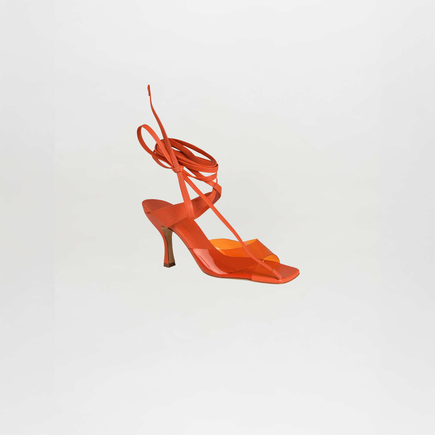 A single orange Marlene Heel in Italian calf leather with ankle wrap straps and a chic quilted toe-thong design is displayed against a plain white background.