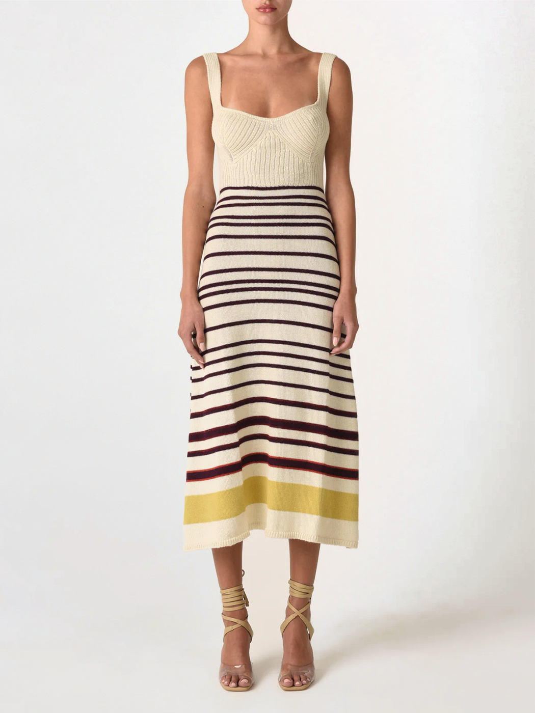 Sleeveless a-line Muriel Dress Multi Mustard Stripe with a beige top and horizontal stripes in black, red, and yellow on the skirt, displayed on a white background.