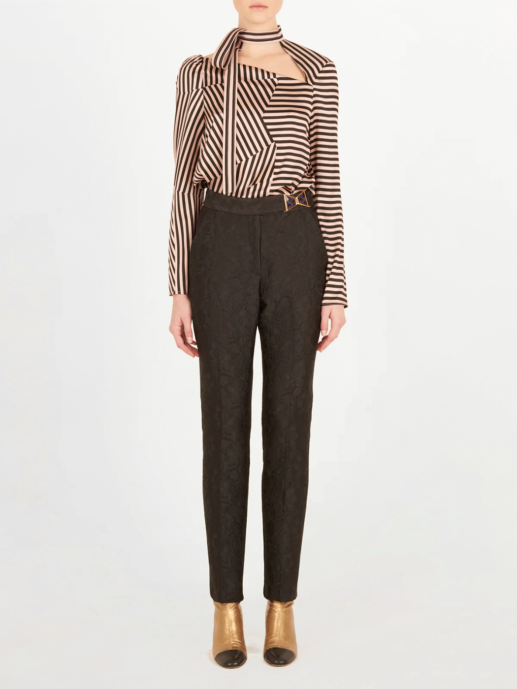 Orion Pant Black high-waisted pants with a patterned design and a gold detail on the waistband.