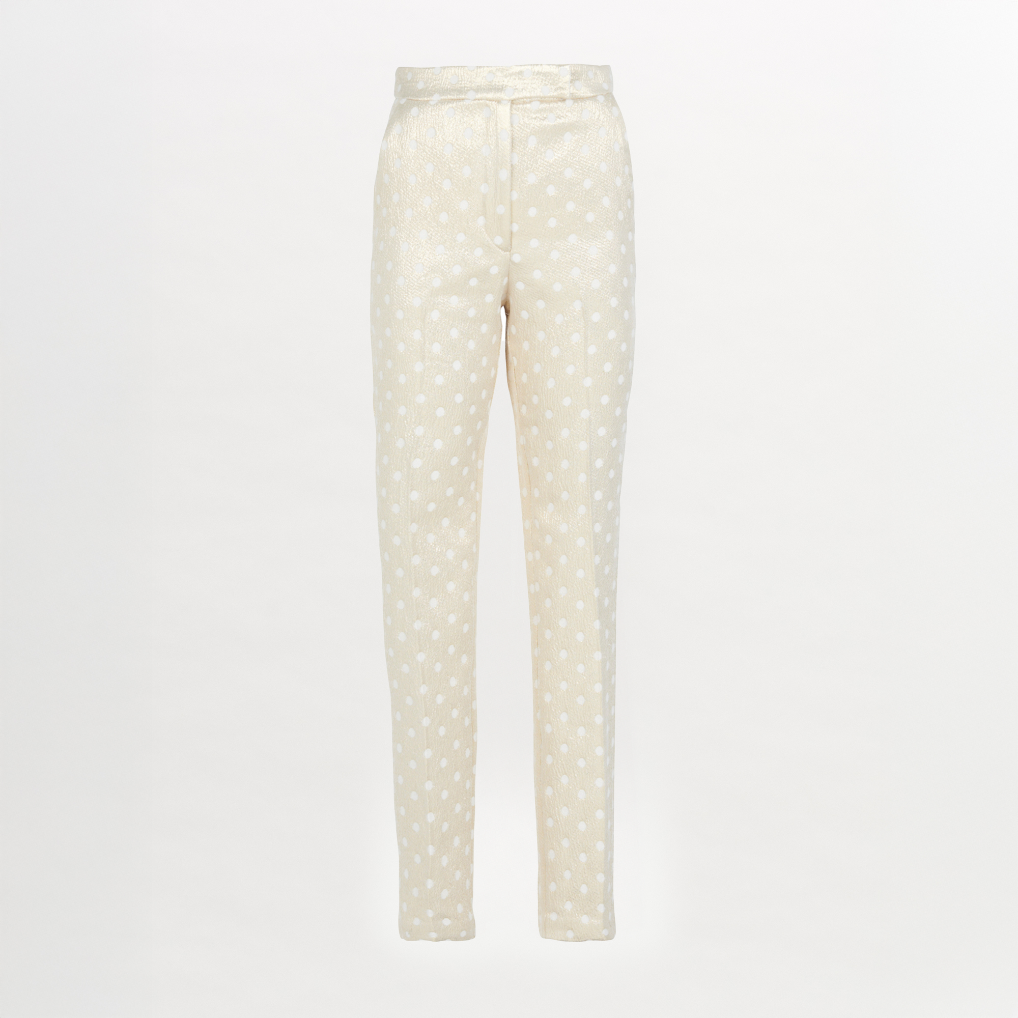 Rear view of a person with long hair in a ponytail, wearing a white blouse and the Orion Pant Gold Inverted, featuring high-waisted trousers with a straight leg silhouette, standing in heels on a plain background.