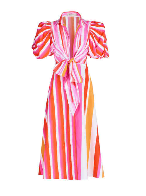 A Pavia Dress Rouge Orange Stripes with a brushstroke stripe print and a bow.
