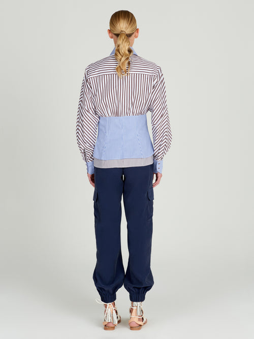 A pair of Jess Pant Navy with an elastic waistband and pockets.