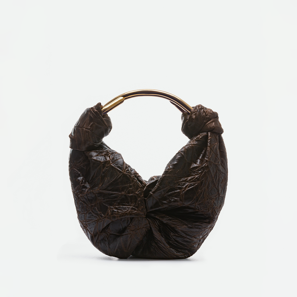 The Sofia Bag (Small), a brown crinkled handbag from Colombia with a round gold-toned handle, is displayed against a plain white background.