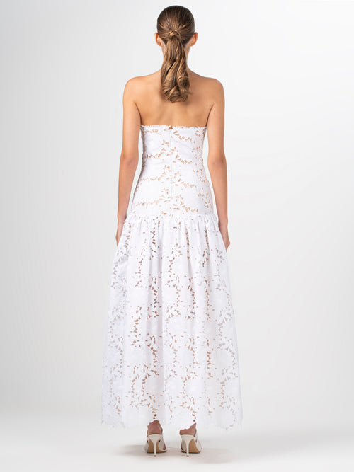 A Margie Dress White with delicate lace detailing.