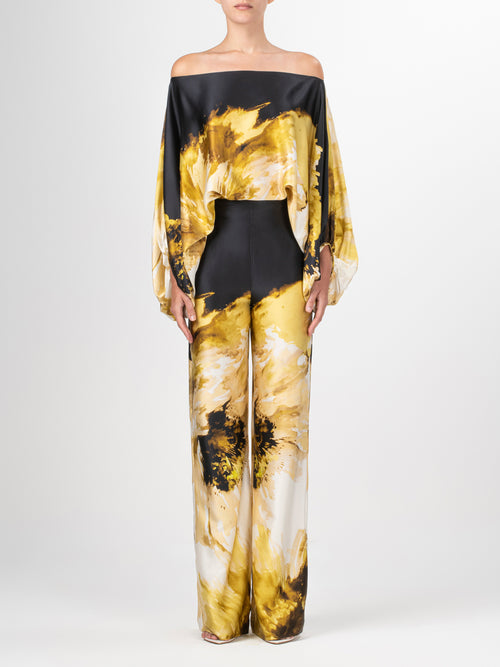 Andie Pant Golden Peony with a floral pattern.