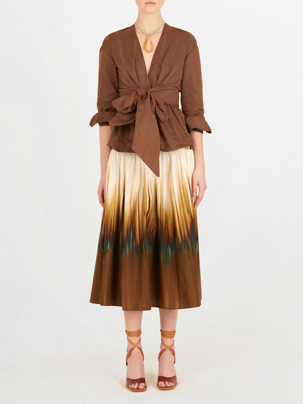A brown blouse with a bow on the front, in the Saanvi Blouse Brown style.
