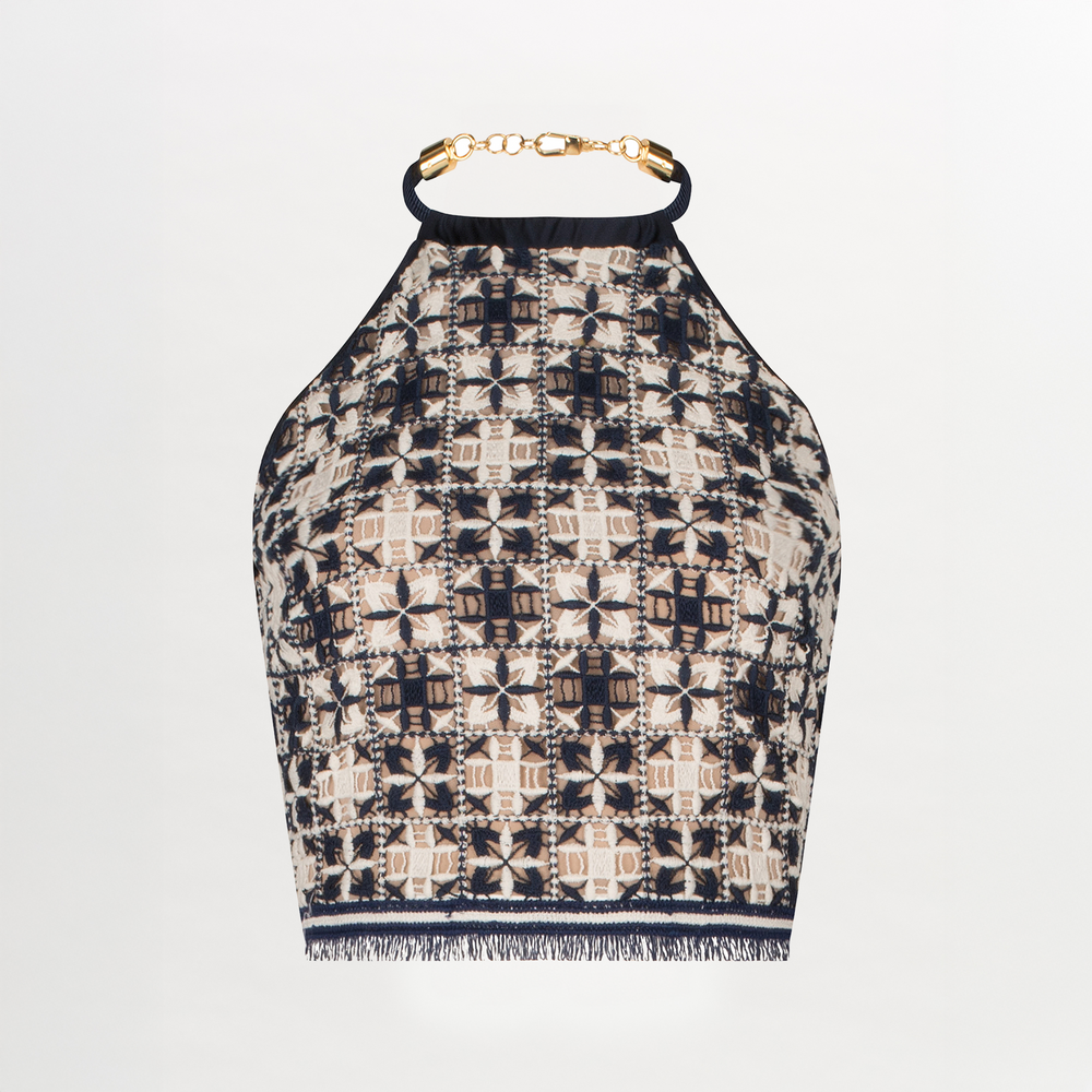 A Salma Top Navy White Crochet with a high neck and gold chain detail.