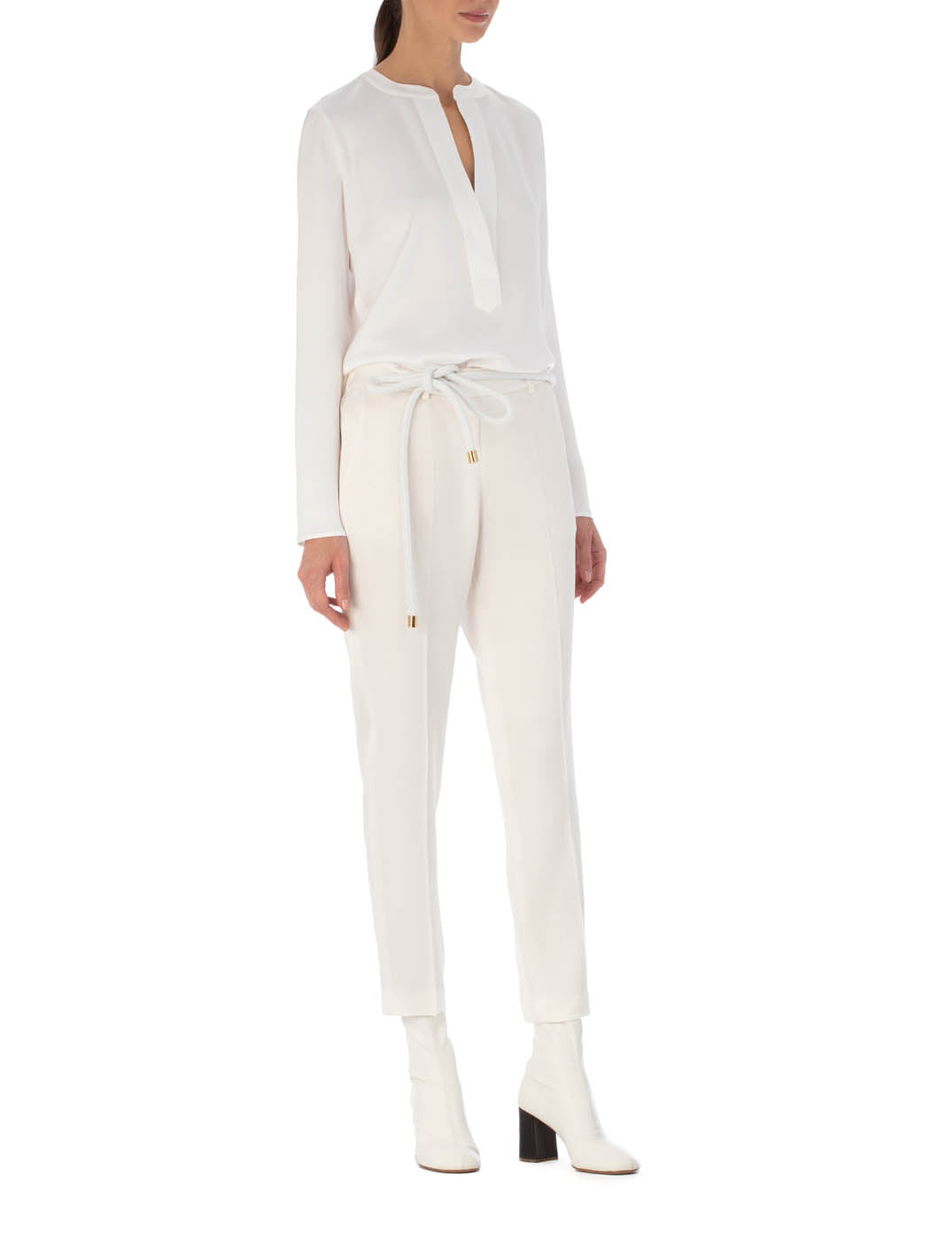 A pair of Bernie Pant White on a plain background.