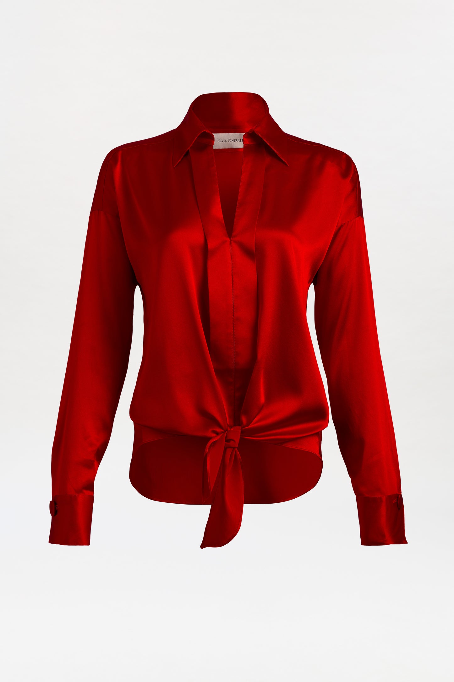 Red blouse with a tie detail on a white background