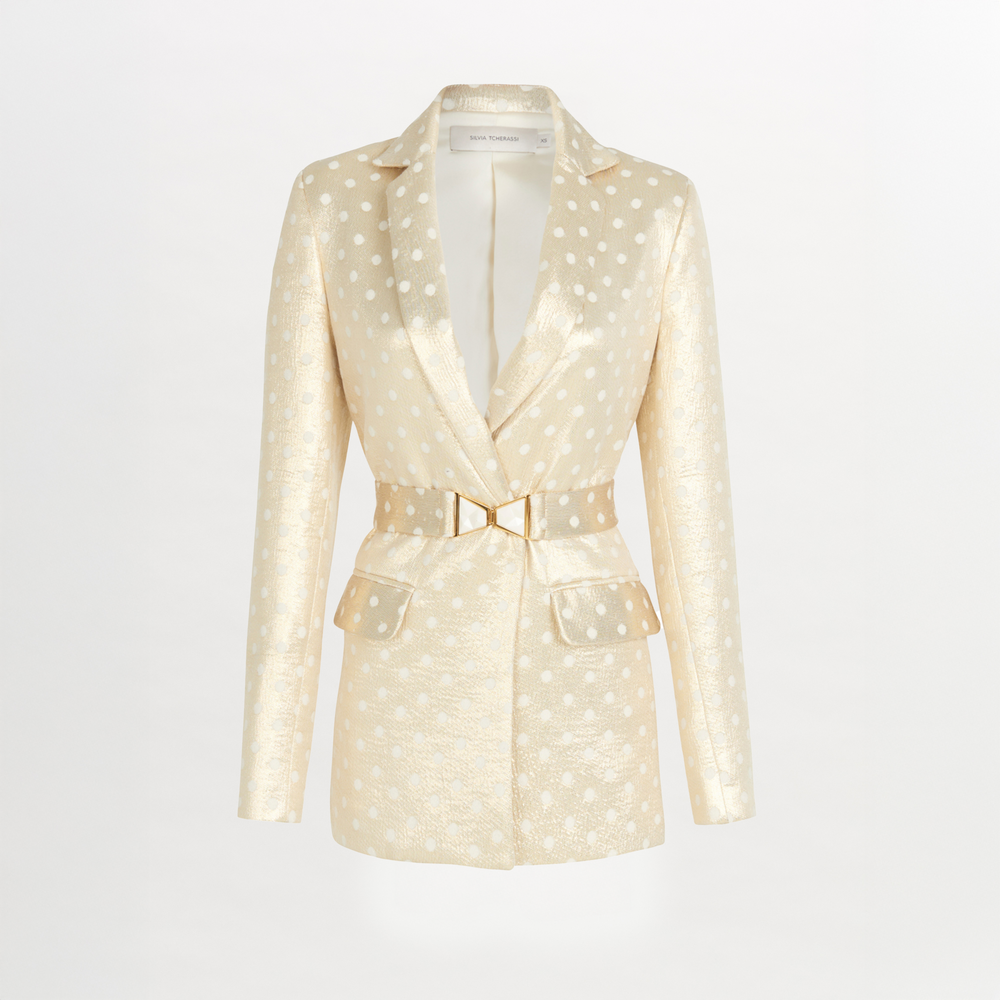 A Sube blazer with polka dots and a gold belt available for Fall 2023.