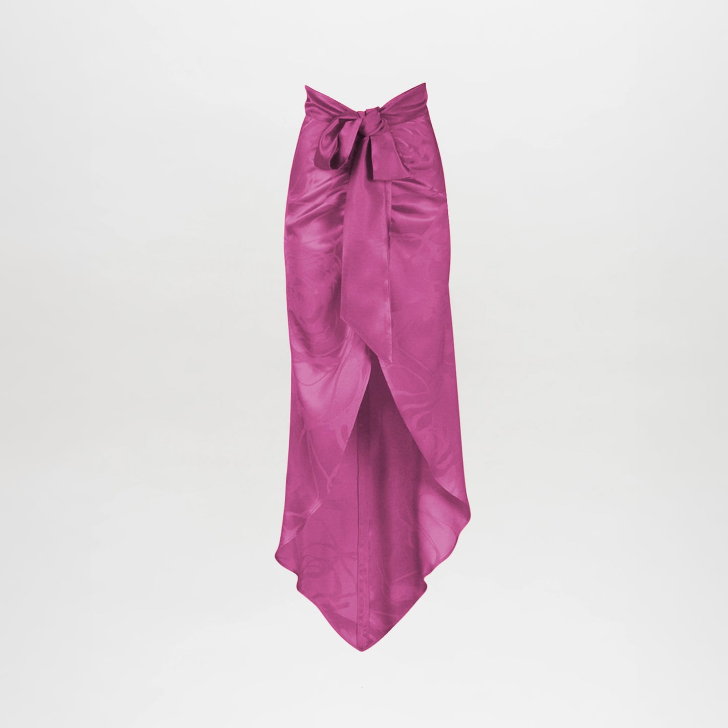 The Tara Skirt Magenta Orchid Jacquard features magenta satin jacquard, a high-low front overlap with a pointed hem, and a wide waist tie bow, displayed on a plain white background.