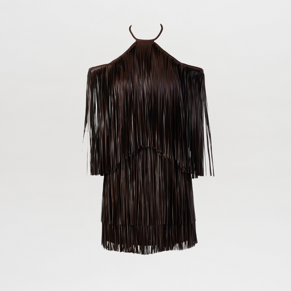 The Vercelli Dress is a black, sleeveless leather mini dress featuring long fringe strands across the entire garment, shown against a plain white background.