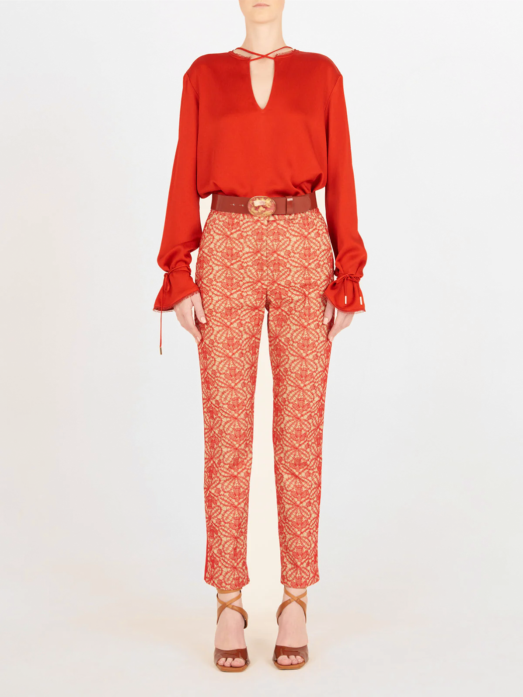 A figure-flattering Zafra Blouse Rouge with lace trim.