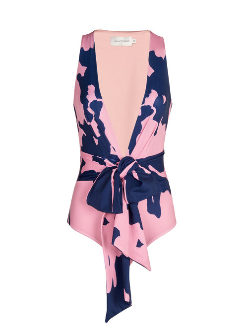 A Zaita One Piece Pink Navy Blossom with a bow on the back, made from lycra fabric.