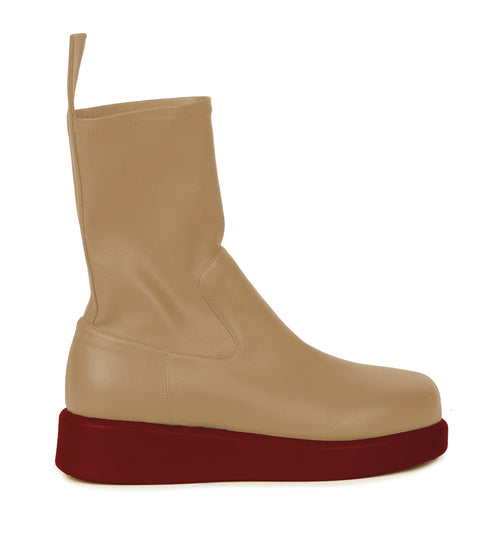 A Baia Boots Beige Brick boot with a red rubber sole, displayed against a white background.