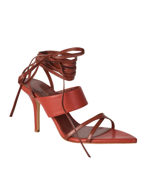 A pair of elegant Jimena Heels Saddle Black strappy high-heeled sandals with lace-up ankle ties, crafted from Italian calf leather.