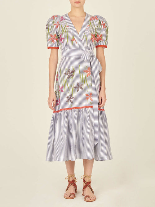 A blue and pink floral embroidered Nicola Dress Blue Pinstripe, featuring an adjustable self-tie waist strap.