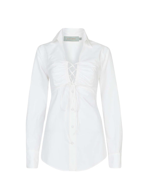 A Dileta Blouse White with lace detailing.