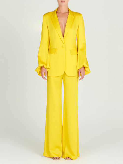A woman's Palermo Pant Yellow high-waist wide leg pants on a mannequin.