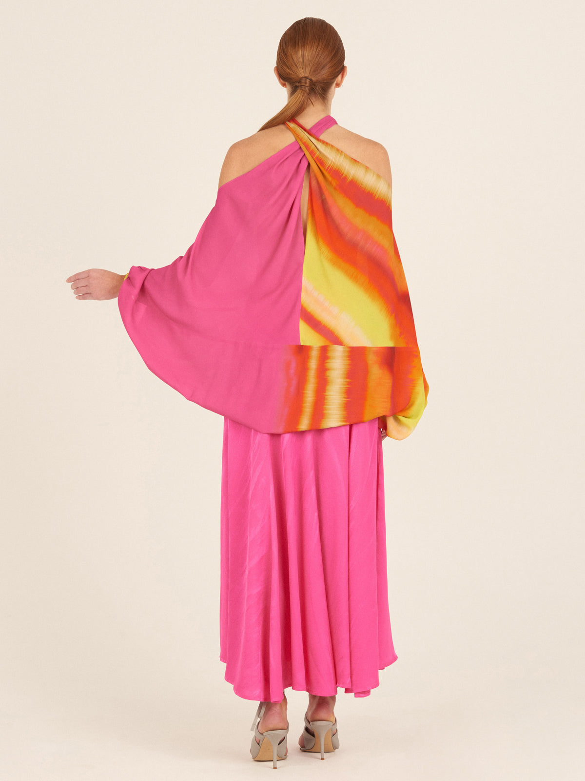 A Juno Blouse Fuschia Lime Stripes with abstract print.