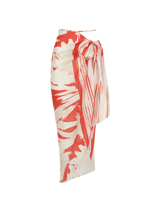 A Alice Skirt Coral Red Palm Print with a bow on it.